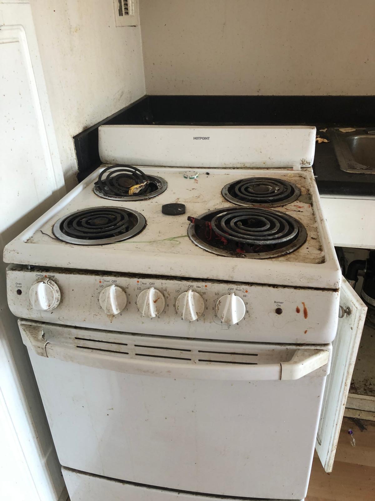 Dirty stove before professional cleaning
