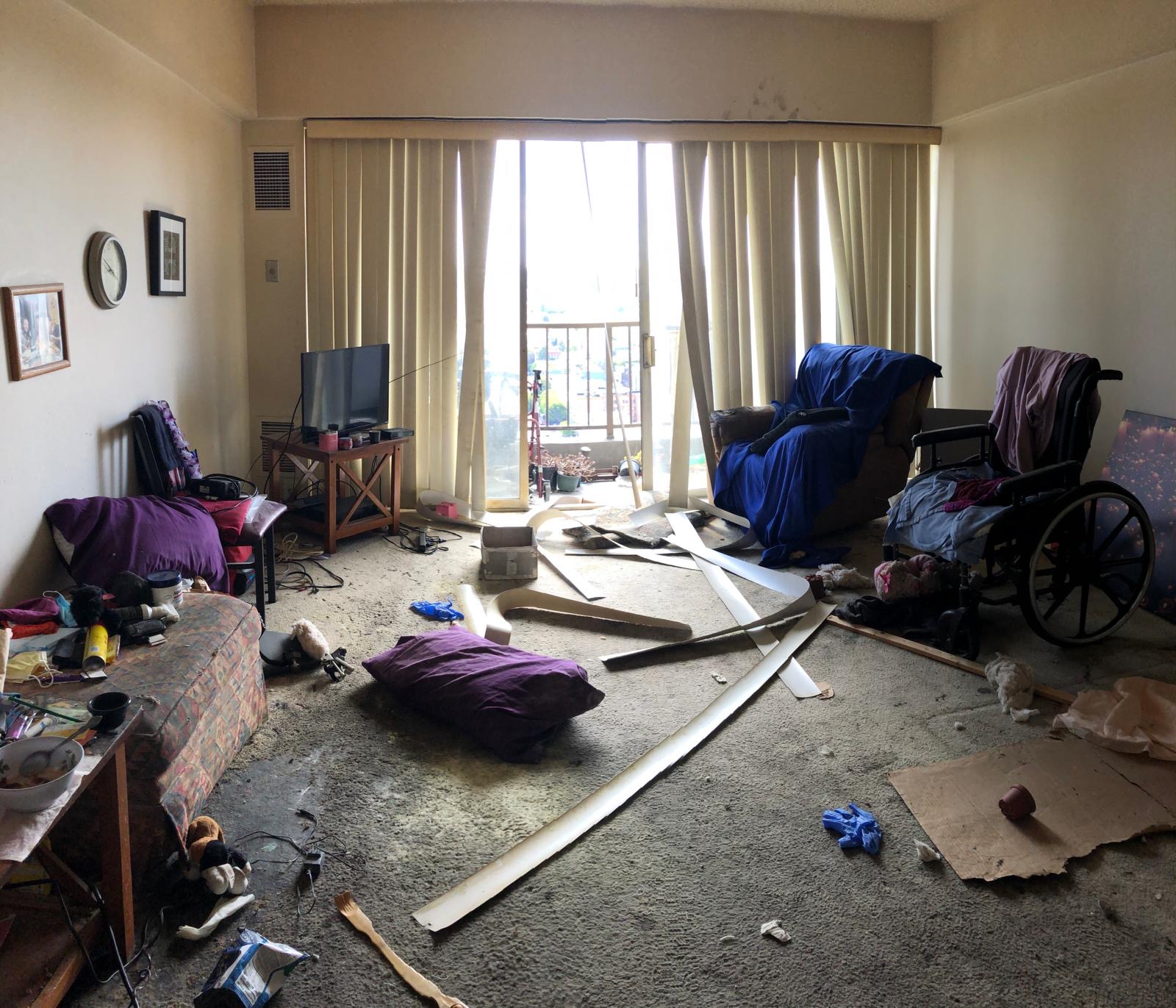 Trashed living room before cleaning
